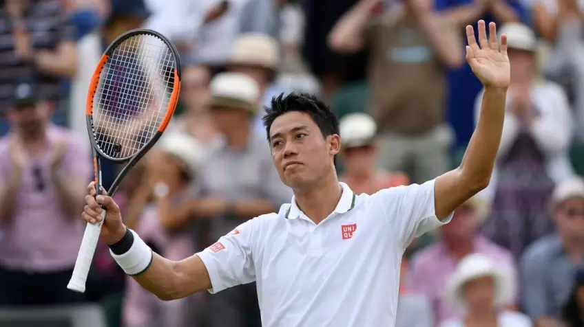 Kei Nishikori reacts to recording 100th Grand Slam win at Wimbledon