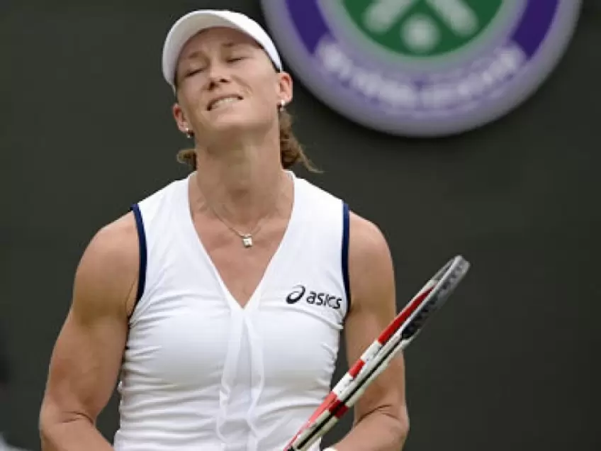 Samantha Stosur and Sloane Stephens slip on the grass in Wimbledon first round