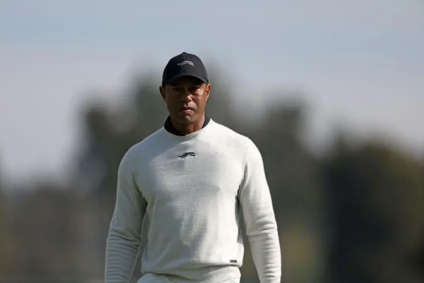 Tiger Woods on TW logo, new shoes, new caddy and swing